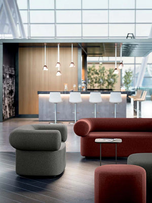 Abbey Round Soft Armchair In Grey With Red Sofa And Pouffe In Waiting Area