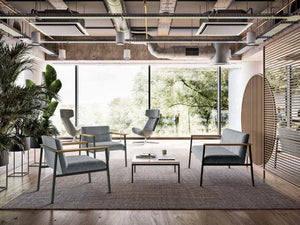 Ado Chair With Wooden Armrests In Grey With Grey Sofa And Low Coffee Table In Lounge Area