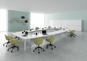Barrel Shaped Boardroom Table with Centre Space in White Finish with Tub Chair in Collaborative Setting