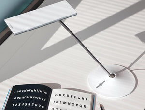 Humanscale Horizon 2 Adjustable Desk Light With Touch Dimming Feature In White On White Table
