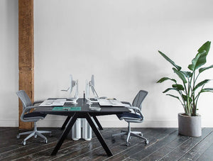 Humanscale Quickstand Under Desk Computer Stand Converter 4 In White With Gray Chair And Black Table