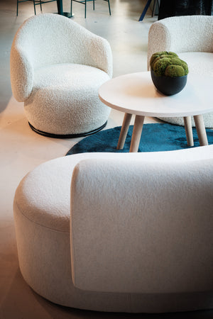 Luna Soft Seating Swivel Chair with White Round Table and White Soft Seating in Lounge Setting 2