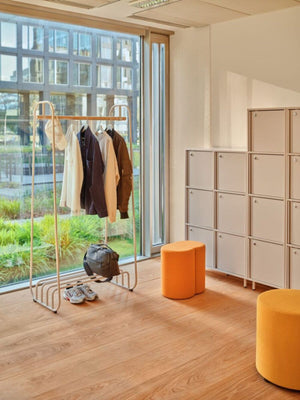 Mix Cube Soft Seating Geometric Pouffe with Coat Rack and Lockers in Modern Office Setting