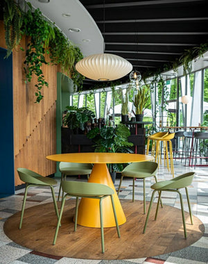 Team Polypropylene Ergonomic Low Stool with Round Canteen Table and High Stool in Canteen Setting