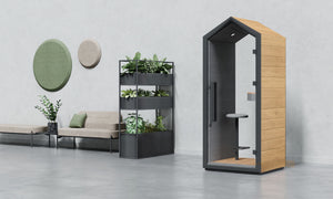 Treehouse Single Person Phonebooth with Stool with0Planter and Sofa in Reception Setting