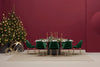 Aero Dining Table in Black Finish with Green Chair and Christmas Tree in Studio Setting