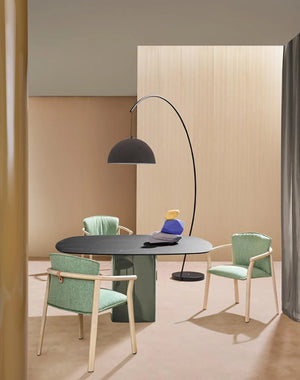 Aero Square Top Dining Table in Black Finish with Standing Lamp and Armchair in Studio Setting