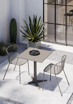 Amitha Stackable Outdoor Chair With Square Table And Plant In Outdoor Setting