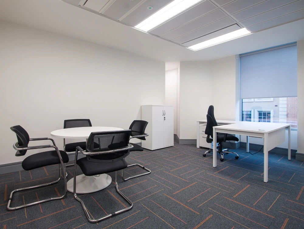 Apex Office Layout White Radial Desk With White Storage And Round Coffee Table With Black Meeting Chairs And Task Office Chair