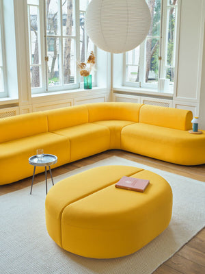 Artiko Upholstered Pouffe With Coffee Table And Sofa In Living Room Setting