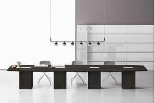 Barrel Shaped Meeting Room Table with Cube Legs in Dark Oak Finish with Swivel Base Chair in Meeting Room Setting