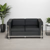Black Faux Leather 3 Seater Sofa with Indoor Plant and Side Table in Living Room Setting