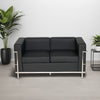 Black Faux Leather 3 Seater Sofa with Indoor Plant and Side Table in Living Room Setting