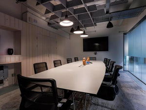BuzziGrid Sound Absorbing Ceiling Solution 6 in Grey with White Top Table and Black Chair in Boardroom