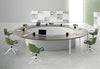 Circular Meeting Room Table in Walnut Top Finish with Swivel Chairs and Bookshelves in Modern Office Setting