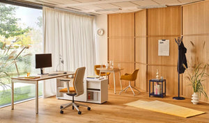 Clip Steel Coat Stand in Black Finish with Round Oak Top Table and Light Brown Armchair in Modern Executive Office Setting