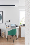 Compact Drive Electric Sit Stand Desk With Table Lamp And Tub Chair In Office Setting