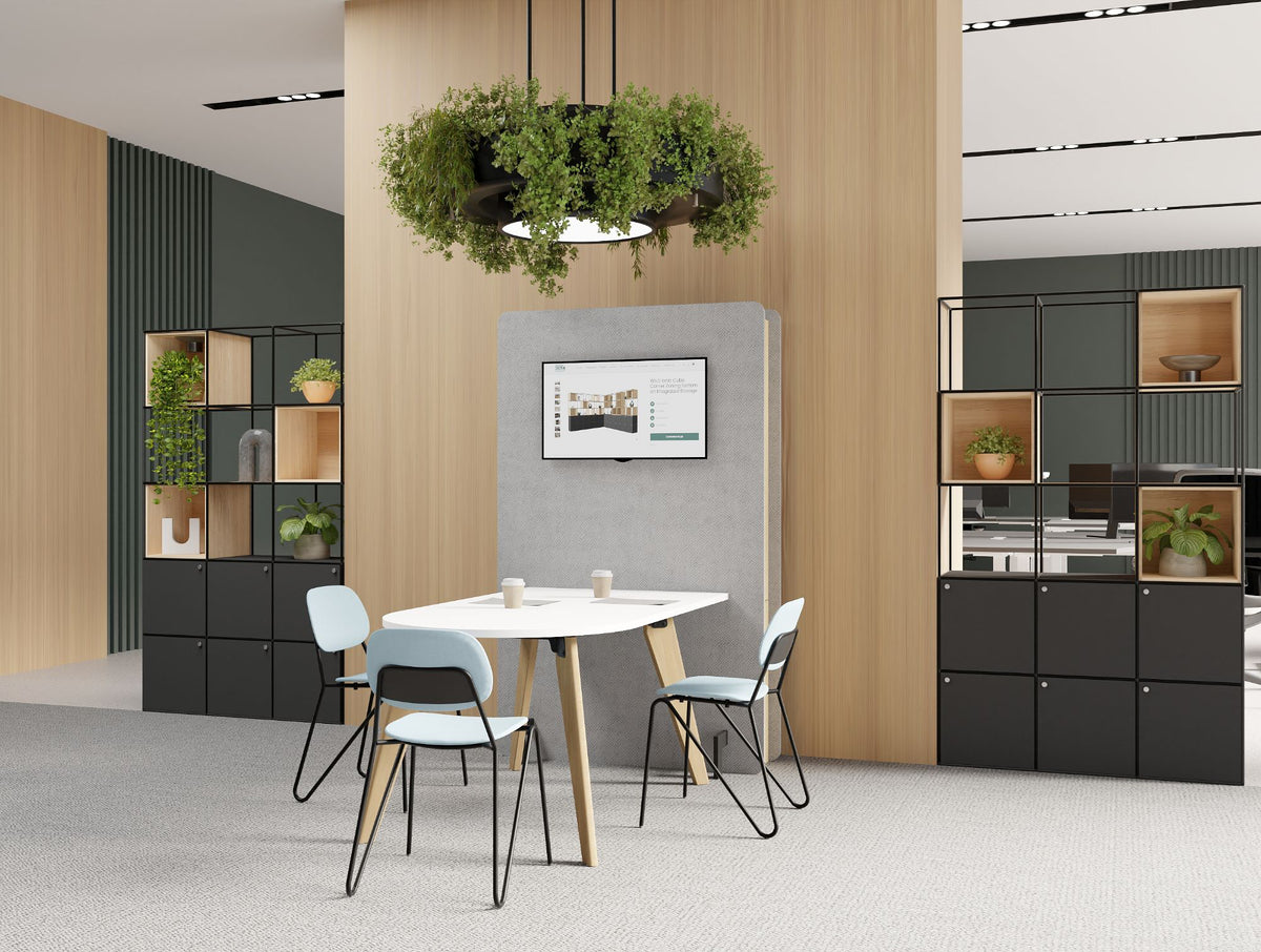 Confer Upholstered Media Wall with Alega Media Table with Fully Upholstered Line Chair and Ionic Modular Zoning System in Modern Office Setting