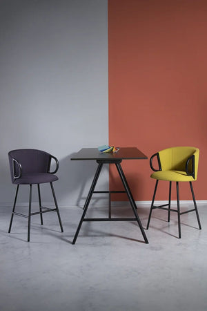 Curacacha Slim Stool With Footrest With High Table In Studio Setting