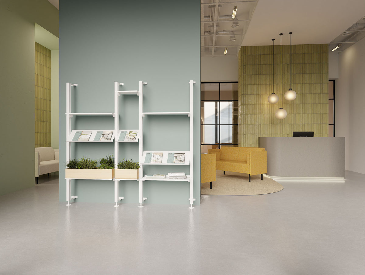 Decora Against the Wall Shelving Unit with Planters in White Finish with Snug Low Back Sofa and Reception Desk in Reception Setting