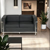 Elite Black Faux Leather 2 Seater Sofa in Lounge Setting