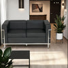 Elite Black Faux Leather 2 Seater Sofa in Lounge Setting