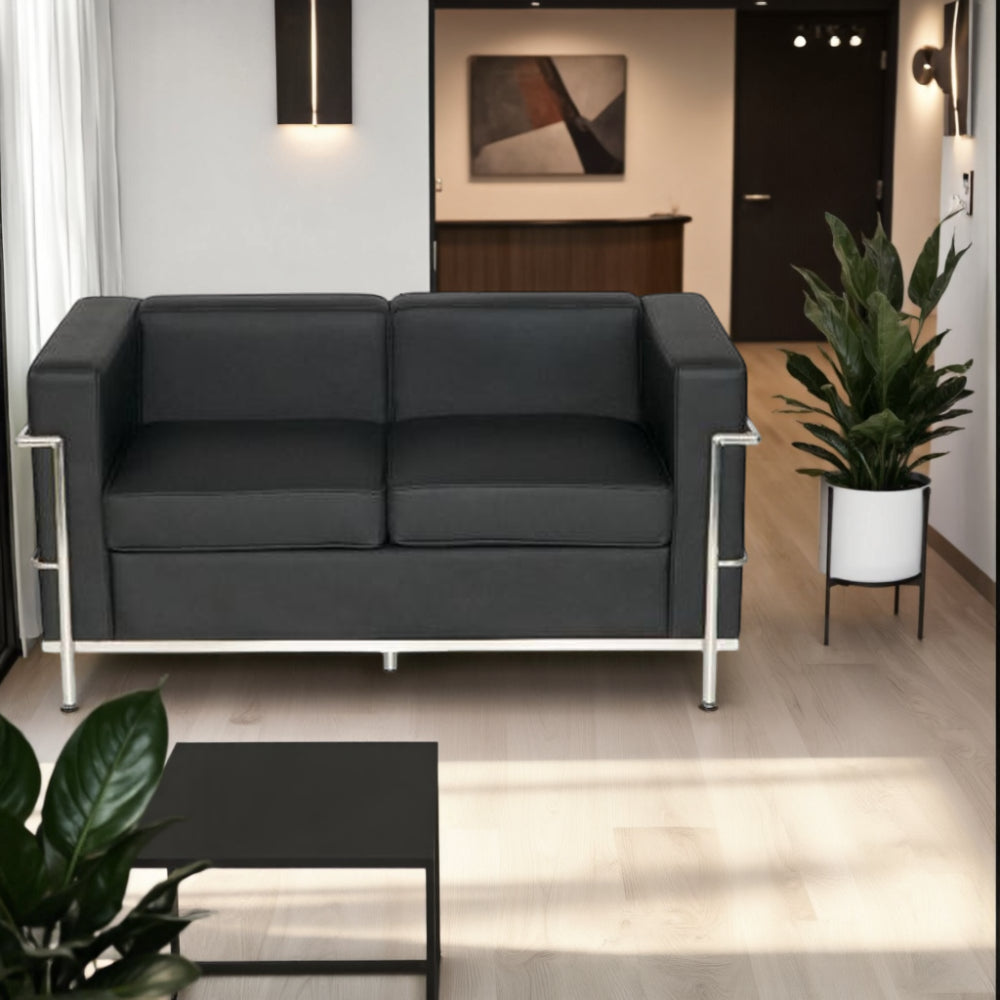 Elite Black Faux Leather 2 Seater Sofa in Lounge Setting