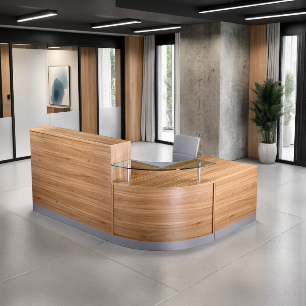 Elite Curved Corner Reception Desk with Indoor Plant and Chair in Reception Setting