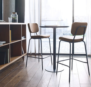 Epocc High Stool with Footrest in Brown Finish with Round Table in Breakout Setting