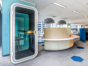 Framery Smart Office Phone Booth With Grey Bar Stool And Plywood Table