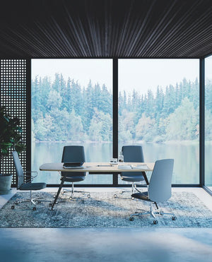 Frezza Spike Meeting Table In Light Oak Finish With Grey Swivel Armchair In Office Setting