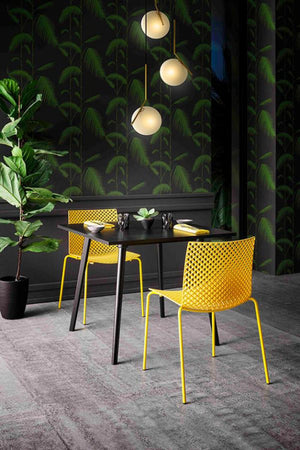 Fuller Stackable Chair With Square Table And Indoor Plant In Cafe Setting