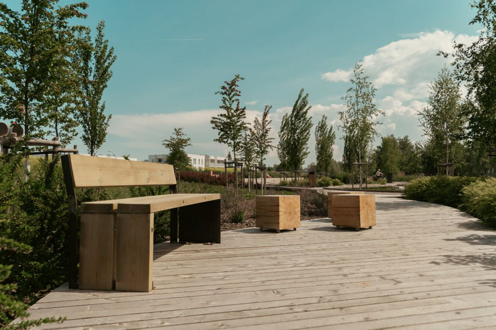 Gavarres Wooden Outdoor Bench with Modular Chairs in Outdoor Setting