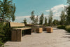 Gavarres Wooden Outdoor Bench with Modular Chairs in Outdoor Setting
