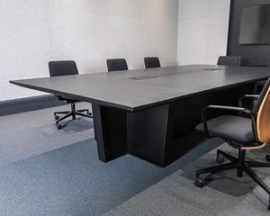 Gravos Conference Table in Black with Black Armchair in Boardroom Setting