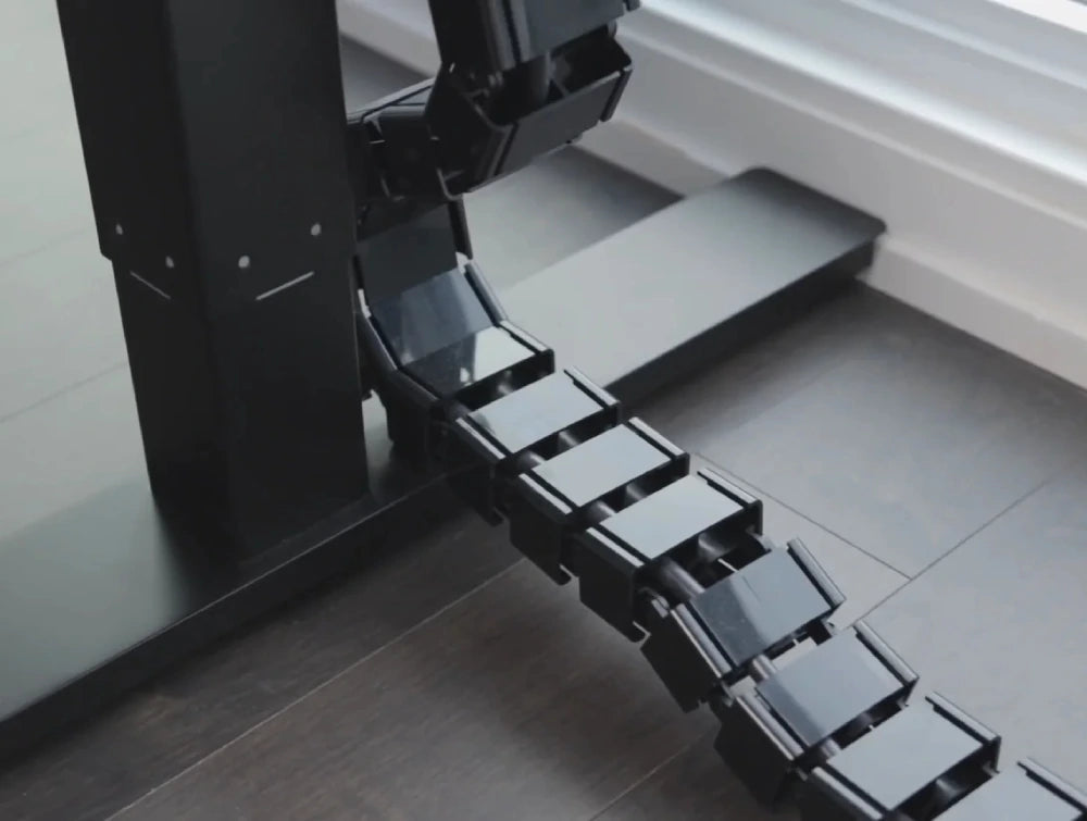 Height Adjustable Square Cable Spine in Black Finish Attached in the Sit Stand Desk