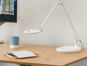 Humanscale Adjustable And Sustainable Element Disk Desk Light 5 In White On Wooden Top Table