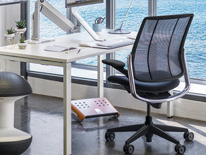 Humanscale Diffrient Smart Task Office Chair With U Shaped Mesh Back 5 In Black Finish With Foot Rocker In Working Area