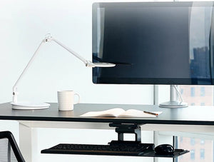 Humanscale Ergonomic Keyboard Tray Drawer 3 In Black On Black Desk With White Desk Lamp And Monitor