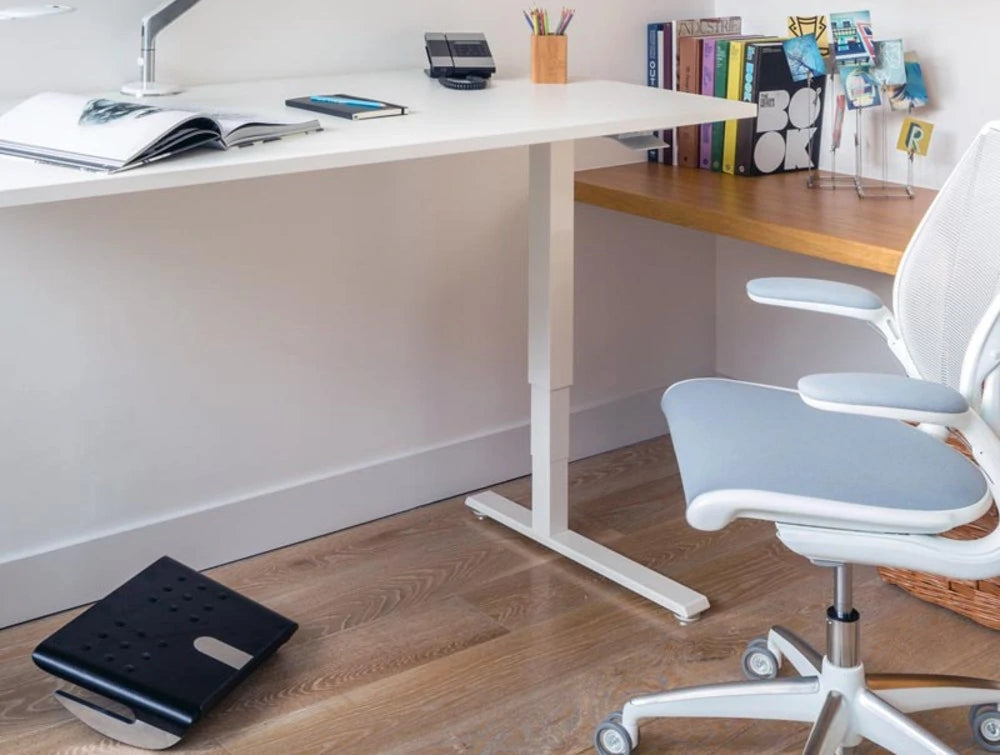 Humanscale Fr500 Ergonomic Foot Rocker With Graceful Curvature 5 In Black Under White Desk Table In Office