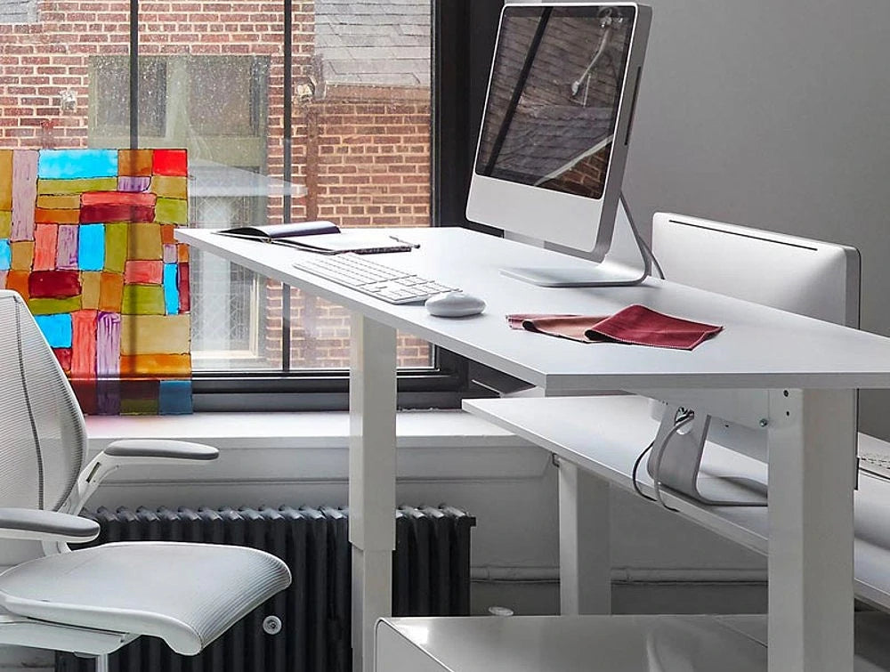 Humanscale Float Standing Office Desk For Office Or Home Areas 8 In White With Single Monitor And White Swivel Chair