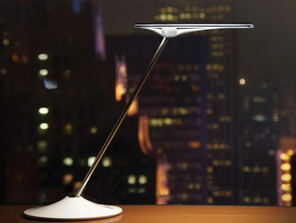 Humanscale Horizon 2 Adjustable Desk Light With Touch Dimming Feature In White On Wood Top Table