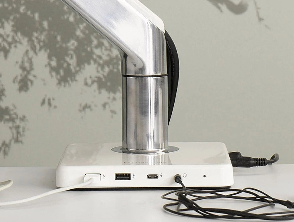 Humanscale Mpower Usb Type A And C Charging Station 5 In White With Cords On White Table