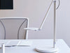 Humanscale Nova Adjustable Desk Light With Charging Desktop Base 7 In White On White Table With White Chair