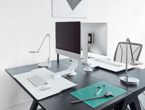 Humanscale Quickstand Under Desk Computer Stand Converter 6 In White With White Keyboard And Mouse On Black Table