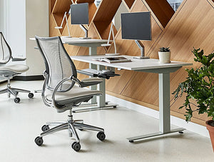 Humanscale Efloat Lite And Efloat Flex Height Adjustable Desk Table 8 With Gray Swivel Chair In Office Area