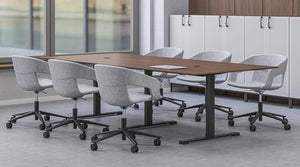 Narbutas Jazz Sit Stand Electric Boardroom Table In Dark Oak Top Finish With Mobile Grey Armchair And Grey Cabinet In Boardroom Setting