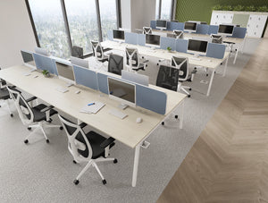 Key Bench Desks with Light Desk Screens in Light Blue Finish with Galen Ergonomic Office Chairs and Uno Lockers with Planters in Modern Office Setting