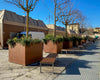 Leman Wooden Backless Outdoor Bench in Brown Finish with Planters in Outdoor Setting 2