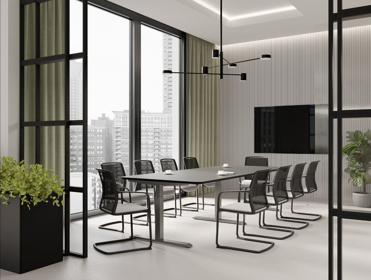 Levo Meet Sit Stand Table with Vela Sled Base Chair in Boardroom Setting